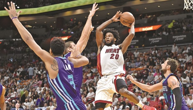 Miami Heat forward Justise Winslow looks to pass the ball as Charlotte Hornets guard Jeremy Lamb (No 3) defends during the first half at American Airlines Arena. PICTURE: USA TODAY Sports