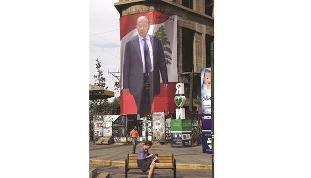 A giant poster that bears the portrait of Lebanese presidential candidate Michel Aoun is seen hanging of a building in Sassine square in Beirutu2019s Ashrafieh neighbourhood.