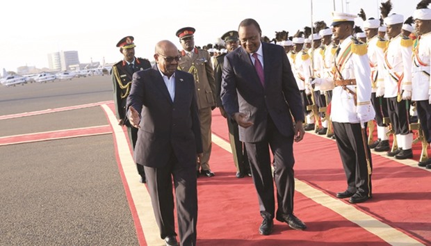 Sudanu2019s President Omar al-Bashir welcomes Kenyau2019s President Uhuru Kenyatta at Khartoum Airport yesterday.