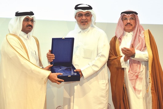 HE al-Sada hands over the  Gulf Safety Award to Oryx GTL chief commercial officer Mohamed Sharif Ibrahim al-Mushiri in the presence al-Ageel. PICTURE: Noushad Thekkayil