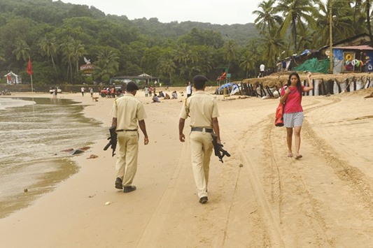 Armed policemen on Baga Beach in Goa.