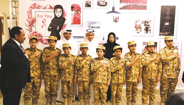 HE the Minister of Public Health  Dr Hanan Mohamed al-Kuwari, Dr Sheikh Khalid bin Jabor al-Thani and other officials with some of the children who participated in the inaugural ceremony.