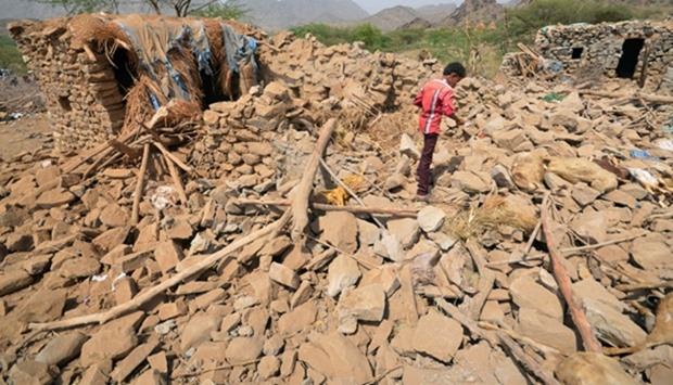 Rubble of houses destroyed by Saudi-led air strikes in Yemen