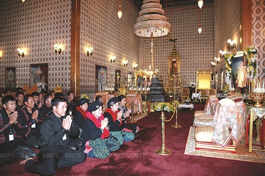 Mourners bow at the throne hall at the Grand Palace to pay respects in front of the golden urn of Thailandu2019s late King Bhumibol Adulyadej in Bangkok.