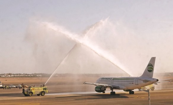 The first Germania airline flight to land at Sharm el-Sheikh airport since the Russian MetroJet plane crash is welcomed at the tarmac yesterday.