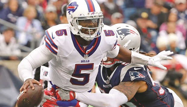 Buffalo Bills quarterback Tyrod Taylor tries to break free from New England Patriots defensive end Jabaal Sheard during the second half of their match. PICTURE: USA TODAY Sports