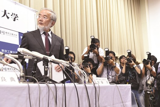 Ohsumi gets up to leave after a press conference in Tokyo on his winning of the 2016 Nobel Prize for Medicine.