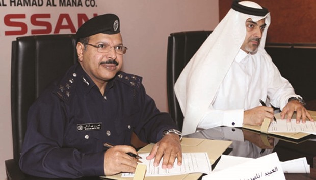 Brig Nasser bin Fahad al-Thani and Hisham Saleh al-Mana sign the sponsorship agreement yesterday. PICTURE: Jayaram
