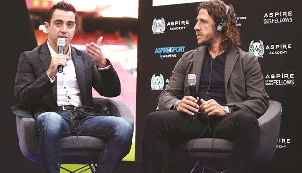 Former Spanish football players Xavi (left), Carles Puyol take part in the Aspire4Sport conference on the future of youth programmes in the football world, at the Amsterdam Arena in Amsterdam yesterday.