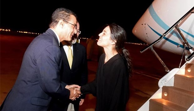 A handout picture released by Oman News Agency shows Nourane Houas being greeted upon her arrival in Muscat on Tuesday.