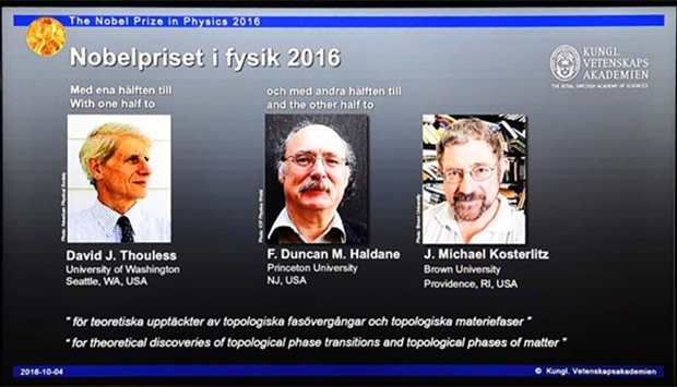 Winners of the Nobel Prize in Physics (left to right) David J Thouless, F Duncan M Haldane and J Michael Kosterlitz are displayed on a screen during a press conference in Stockholm on Tuesday.