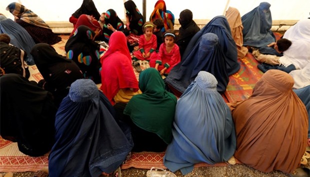 Afghan women with their children at UNHCR registration centre in Kabul