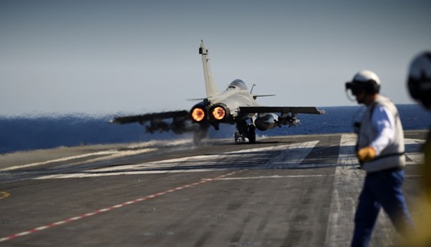A Marine Rafale jet fighter lifts off from the French aircraft carrier Charles de Gaulle, in the Mediterranean Sea on October 2, 2016 as part of the Operation Arromanches III.