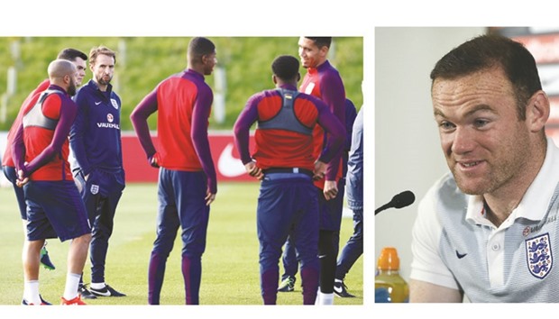 England interim manager Gareth Southgate with players during training at teamu2019s training facility at St Georgeu2019s Park in Burton-upon-Trent, in central England. (Right photo) Englandu2019s striker Wayne Rooney speaks at a press conference yesterday.