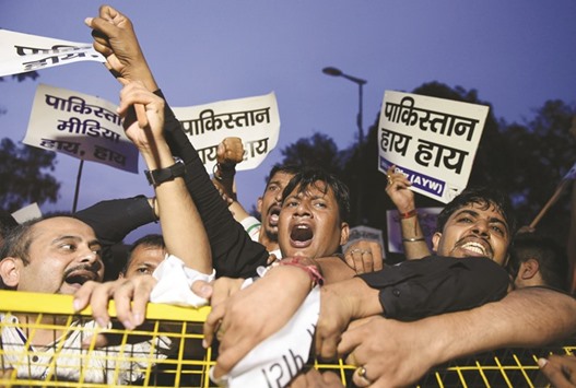 Activists and supporters of the Aam Aadmi Party (APP) shout anti-Pakistan slogans during a protest as they try to march towards the Pakistani High Commission in New Delhi yesterday.
