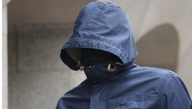 Mazher Mahmood arrives at court concealing his identity