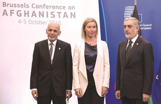 Ashraf Ghani, left, High Representative of the Union for Foreign Affairs and Security Policy / Vice-President of the Commission Federica Mogherini, centre, and Afghanistanu2019s Chief Executive Abdullah Abdullah arrive for a meeting on Afghanistan at the EU headquarters in Brussels yesterday.