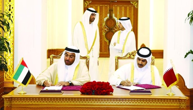 Al-Kaabi and al-Sayegh signing the new long-term gas sale and purchase agreement in the presence of HE the Prime Minister and Minister of Interior Sheikh Abdullah bin Nasser bin Khalifa al-Thani and the UAE Minister of State and chief executive of Abu Dhabi National Oil Company Dr Sultan bin Ahmed al-Jaber