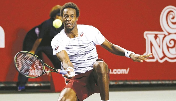 Gael Monfils of France returns during his win over Ivo Karlovic of Croatia. (Reuters)