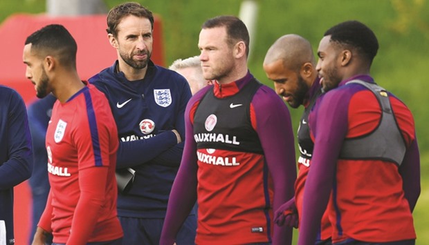 England interim manager Gareth Southgate (2L) during training.