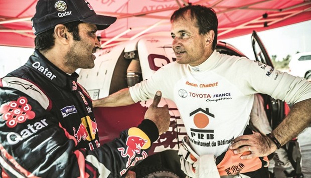 Qataru2019s Nasser Saleh al-Attiyah with French driver Ronan Chabot in during the Rally of Morocco.