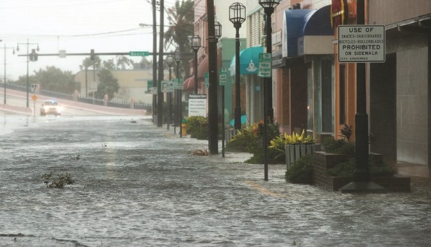 Water covers portions of International Speedway Boulevard in Daytona Beach after Hurricane Matthew passes through yesterday. Florida, Georgia, South Carolina and North Carolina have all declared a state of emergency.