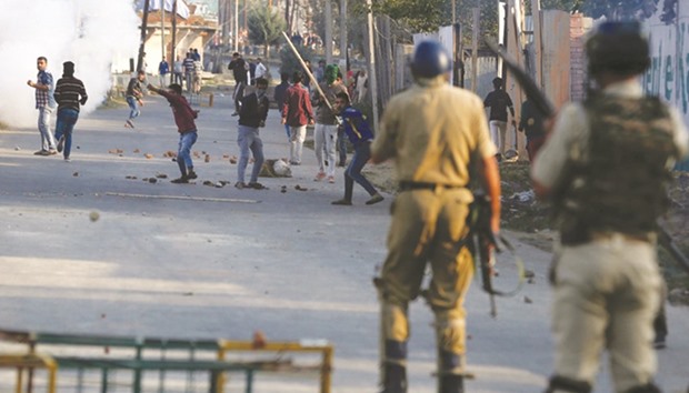 Protesters clash with police during the funeral procession of Junaid Ahmad, 12, in Srinagar yesterday.