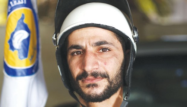 Abu Yasser, a White Helmets Syrian civil defence volunteer poses for a picture in the rebel-held town of Douma, on the eastern outskirts of the Syrian capital Damascus. White Helmets, who missed out the Nobel Peace Prize on Friday, are volunteers who gave up lives as bakers, decorators or students to rescue the victims of their countryu2019s devastating civil war.