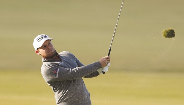 Englandu2019s Tyrrell Hatton plays his approach shot on the 18th hole during the third round of the Alfred Dunhill Links Championship yesterday. (Reuters)