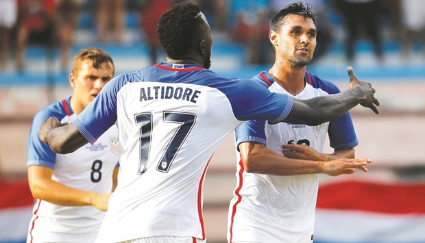 Chris Wondolowski (R) of the United States is congratulated by Jozy Altidore after scoring the first goal against Cuba at Estadio Pedro Marrero in Havana on Friday. (AFP)