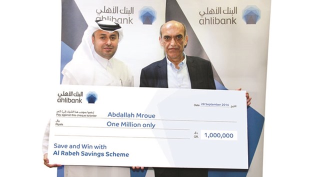 Ahlibank deputy CEO, Retail and Private Banking, Hassan al-Efrangi hands over the cheque to Abdallah Mroue.