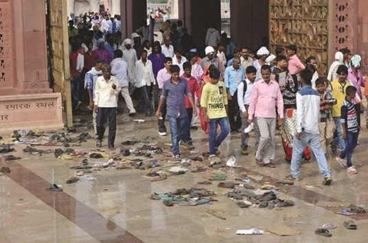 Footwear is strewn at the venue of Mayawatiu2019s rally where a stampede broke out yesterday, in Lucknow.