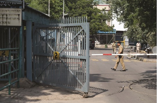 A security guard stands near a barricade at New Delhiu2019s international airport yesterday.