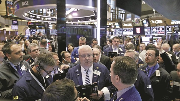 Traders work on the floor of the New York Stock Exchange. The S&P 500 Index tumbled 0.7% to 2,153.74 points in the five days, its worst decline since the week ended September 9.