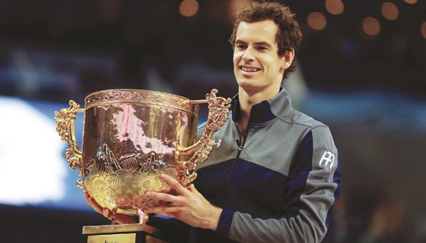 Britainu2019s Andy Murray holds his trophy after defeating Bulgariau2019s Grigor Dimitrov in the final of the China Open yesterday. (Reuters)
