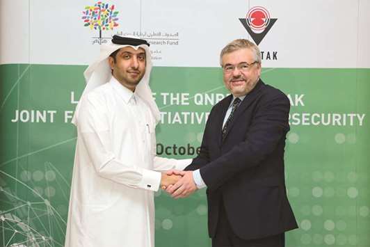 Dr Hamad al-Ibrahim, executive vice president, QF R&D, and Dr Orkun Hasekioglu, vice president, TUBITAK shake hands during the event. Supplied picture