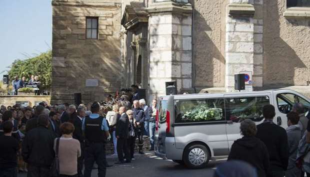 People attend the funerals of Mauranne and Laura, two 20-year-old cousins stabbed on October 1, 2017 outside Saint-Charles train station in the coastal city of Marseille at the church of Eguilles, southern France, on October 5, 2017