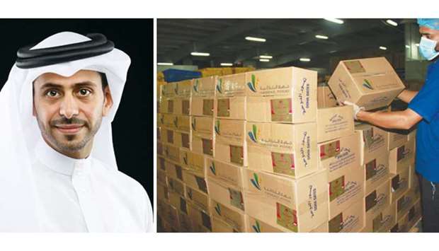 Hassad Food CEO Mohamed Badr al-Sada. A worker loads boxes of dates to be exported to India.