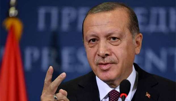 Turkish President Recep Tayyip Erdogan gestures as he speaks during a press conference in Belgrade on Tuesday.