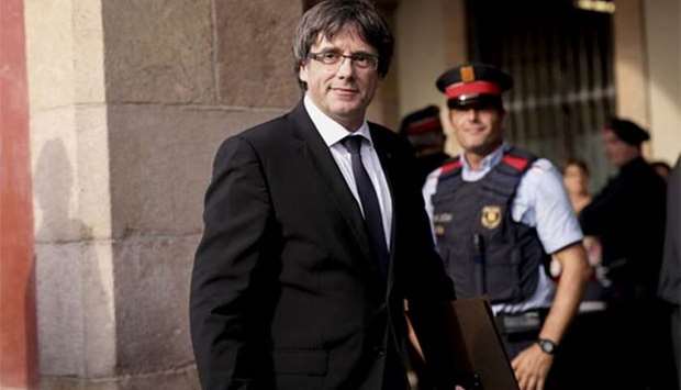 Catalan regional government president Carles Puigdemont arrives to address the regional parliament in Barcelona on Tuesday.