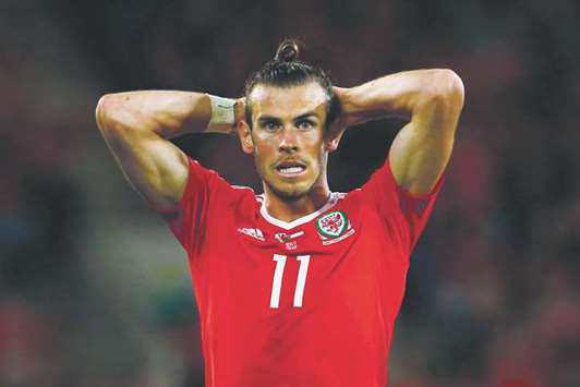 Injured Gareth Bale was a powerless spectator as Walesu2019s World Cup dreams were crushed by the Republic of Ireland on Monday night. (AFP)