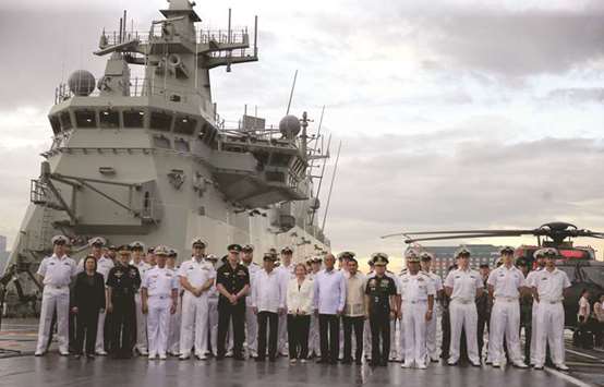 President Rodrigo Duterte poses with Australian Navy officials led by Australian ambassador to the Philippines Amanda Gorely during a tour on board the the Royal Australian Navy (RAN) vessel, Her Majestyu2019s Australian Ship (HMAS) Adelaide III upon arrival for a goodwill visit as part of the Australian Defence Force (ADF) Joint Task Group Indo-Pacific Endeavour 2017 at the Pier 15, south harbour in Metro Manila, yesterday.