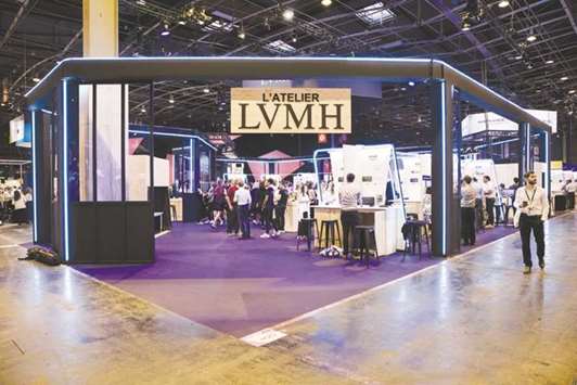 Attendees visit the LVMH Moet Hennessy Louis Vuitton technology workshop at the Viva Technology conference in Paris on June 15, 2017. Third-quarter sales grew 12% on an organic basis, LVMH said, beating analyst expectations.