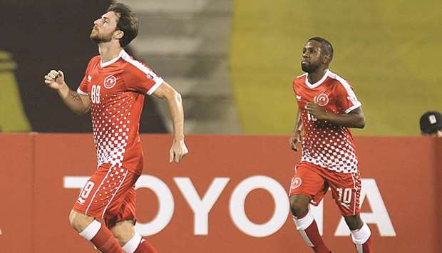 Al Arabiu2019s Diego Jardel (left) celebrates after scoring the teamu2019s first goal with teammate Khalfan Ibrahim against Qatar SC during their QNB Stars League match at Grand Hamad Stadium yesterday. PICTURE: Noushad Thekkayil