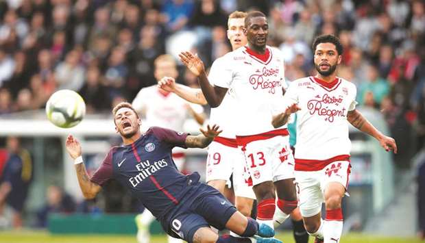 Paris Saint-Germainu2019s Neymar goes down under a challenge from Bordeaux player during the Ligue 1 match at Parc des Princes in Paris yesterday. (Reuters)