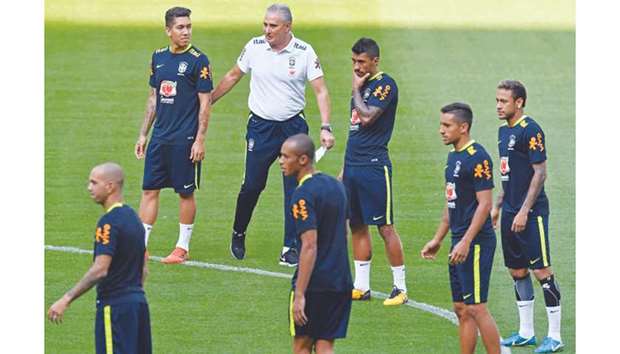 Under Tite's (centre) guidance, Brazil won 10 and drew two of their qualifiers. (AFP)