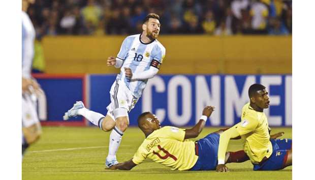 Argentina's superstar Lionel Messi leaves Ecuador defenders in their wake as he scores during the 2018 World Cup qualifier football match in Quito, Ecuador, on Tuesday night. (AFP)
