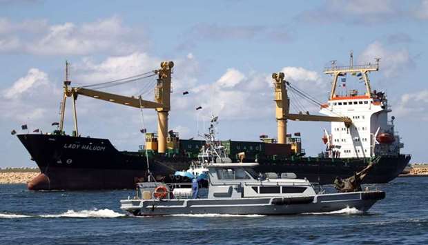 A ship is seen docked at the Benghazi port, which was closed for the past three years due to rebel groups occupying the eastern Libyan city, during a ceremony marking the re-opening of the port on October 1, 2017.  AFP