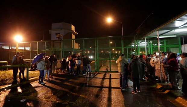 Relatives of inmates wait for news of their loved ones outside the Cadereyta state prison after a riot broke out at the prison, in Cadereyta Jimenez, on the outskirts of Monterrey, Mexico.