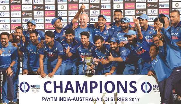 India players pose with the trophy after winning the fifth one-day international against Australia at the Vidarbha Cricket Association Stadium in Nagpur yesterday. (AFP)